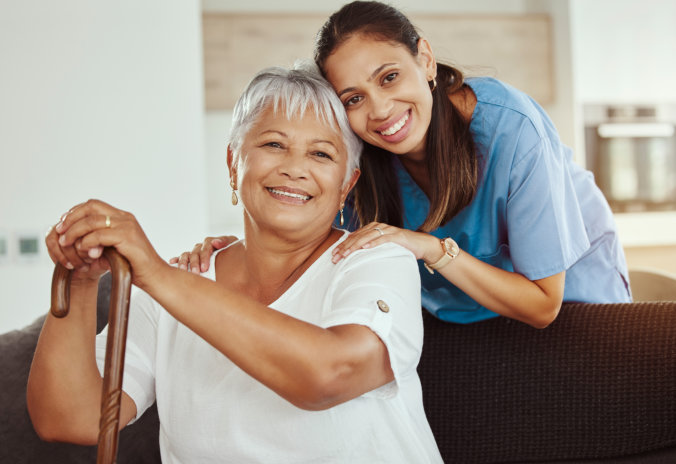 an elderly woman and a caretaker